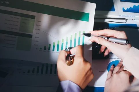 Above table with finance papers, graphs and big data during teamwork meetin.. Stock Photos