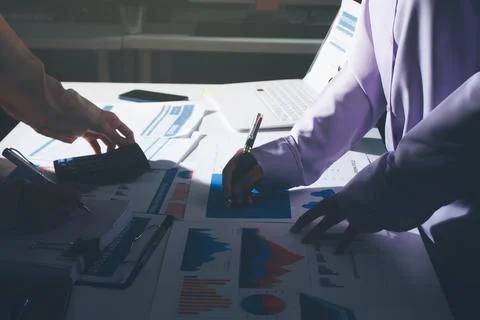 Above table with finance papers, graphs and big data during teamwork meetin.. Stock Photos