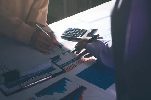 Above table with finance papers, graphs and big data during teamwork meetin.. Stock Photos