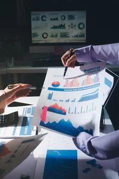 Above table with finance papers, graphs and big data during teamwork meetin.. Stock Photos