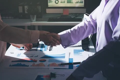 Above table with finance papers, graphs and big data during teamwork meetin.. Stock Photos