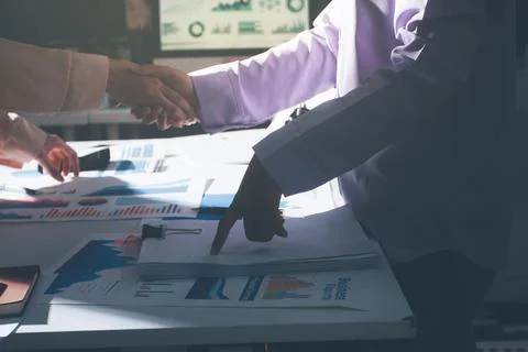 Above table with finance papers, graphs and big data during teamwork meetin.. Stock Photos
