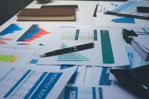 Above table with finance papers, graphs and big data during teamwork meetin.. Stock Photos