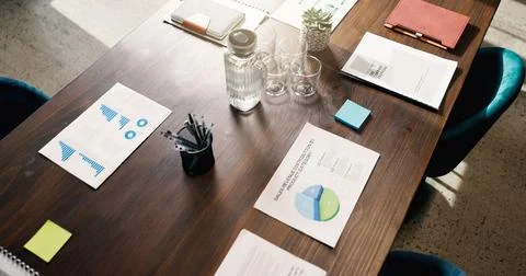 Above, table or paperwork in empty office with data, sales revenue charts or Stock Photos
