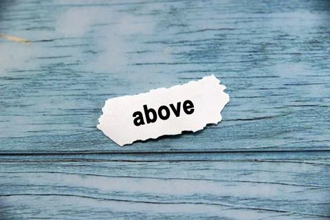 Above Text or message short word english letter on white paper with blue pa.. Stock Photos