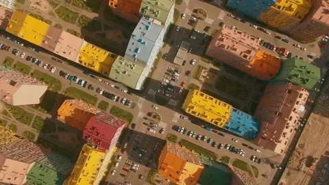 Above top view cozy comfortable colored houses in a European city 4K UHD aerial Stock Footage 75010638