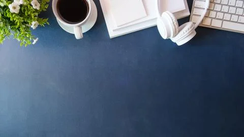 Above view coffee cup, notebook and wireless keyboard on table. Stock Photos