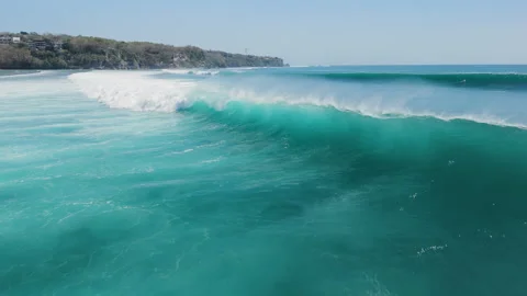 Above view with crashing surfing waves in ocean on Impossibles beach 動画素材 345127437