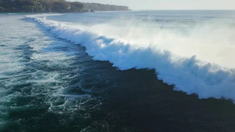 Above view with crashing surfing waves in ocean on Impossibles beach 動画素材 345127795