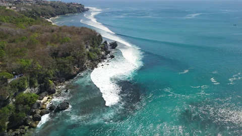 Above view with crashing surfing waves in ocean on Padang Padang beach Stock Footage 345128810