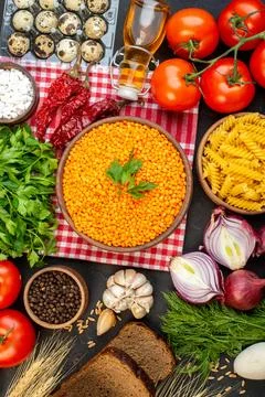 Above view of fresh vegetables bread slices red lentils in a brown bowl pep.. 스톡 사진
