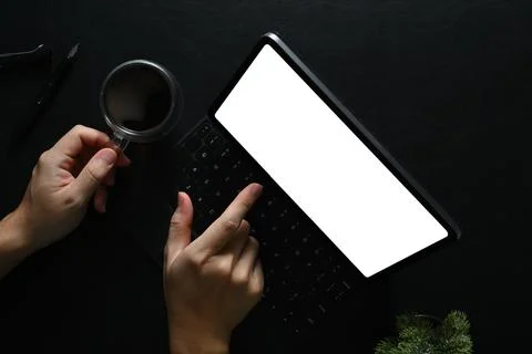 Above view of man using digital tablet on black wooden table, Blank for your Stock Photos