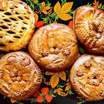 Above view of patterned closed Russian pies Stock Photos