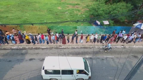 Above view of  People on the queue to get in bus in front of American embassy Video stock 209176910