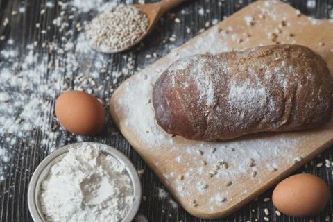 Above view of a rustic loaf  bread on an old wooden tabl Stock Photos