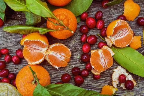 Above view tabletop tangerines and raw cranberries Stock Photos