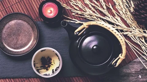 Above view of tea pot and bread on a wooden table Stock Footage 82177204