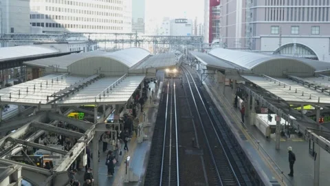 Above view of train arriving at station at Osaka, Japan Stock Footage 326363524