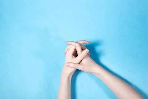 Above view of two hands with interlaced fingers Stock Photos