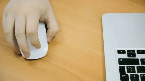Above, women's hands work by computer. White keyboard and mouse. Stock Footage 97713111