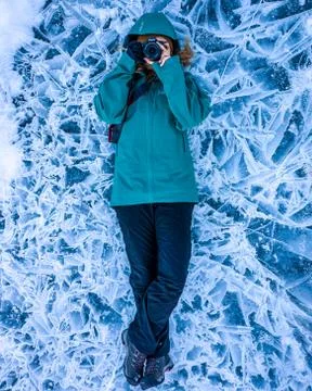 Abraham Lake Photographer on ice pattern Stock Photos