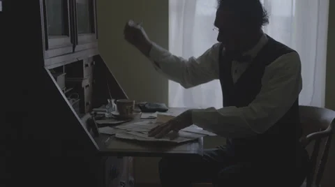 Abraham Lincoln Writes at Desk Stock Footage 54282602