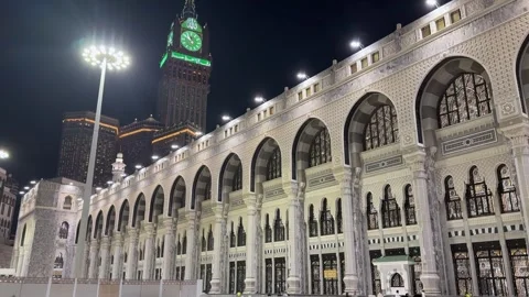 Abraj Al Bait Clock Tower Overlooking Masjid Al Haram at Night in Mecca Stock Footage 339193643