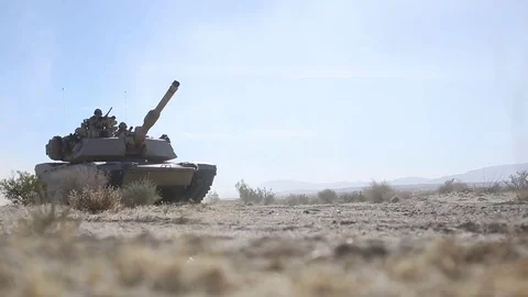 Abrams tank tracking with gun aimed Video stock 84789675