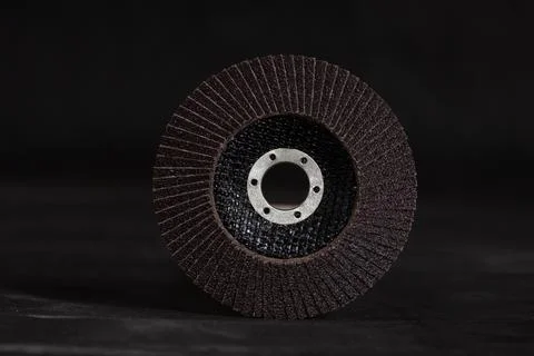 An abrasive disc for an angle grinder on a black background. The image capt.. Stock Photos