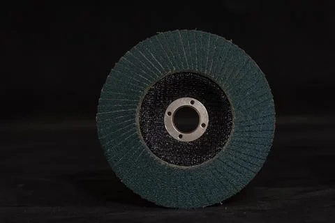 An abrasive disc for an angle grinder on a black background. The image capt.. Stock Photos
