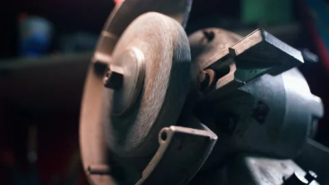 The abrasive wheel of the grinding machine stops, close-up Stock Footage 236083429