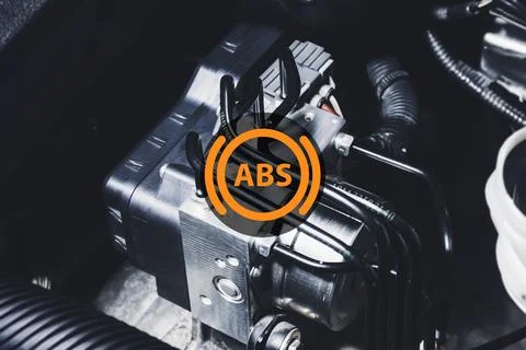 ABS electronic pump module of car brake system with ABS symbol Stock Photos