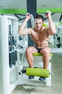 Abs exercise on a machine Stock Photos
