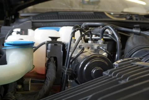 ABS unit installed in the engine compartment of the car. Foto stock