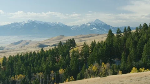 The Absaroka mountains tower above the Paradise Valley and Yellowstone river in Stock Footage