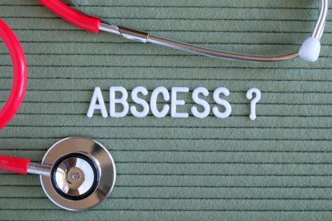 Abscess- text with a question mark on  green background with  stethoscope, me Fotos de archivo