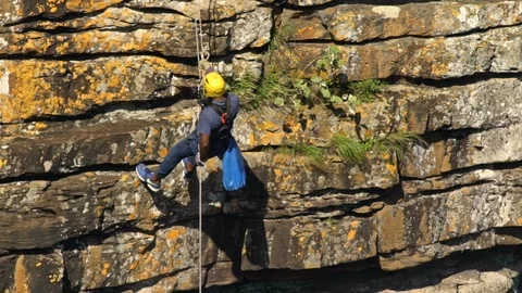 Abseiling down a cliff at Oribi Gorge Stock Footage 116276104