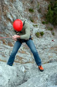 Abseiling or rappelling in climbing Stock Photos