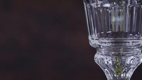 Absinthe is poured into a glass Stock Footage