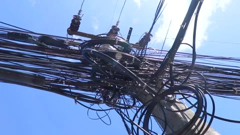 Absolute cable chaos on Thai power pole blue sky Thailand. Stock Footage 327179148