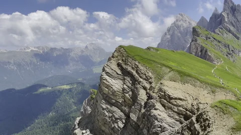 An absolutely breathtaking mountain landscape featuring a stunning, cloudy sky Stock Footage 280765942