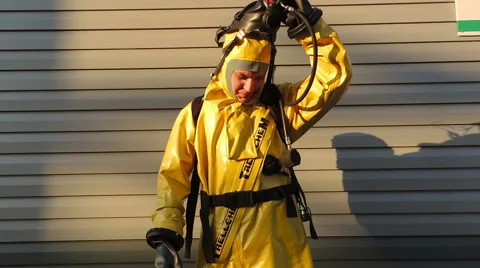 Absolve themselves of breathing apparatus and protective clothing, chemical, Video stock 49071967
