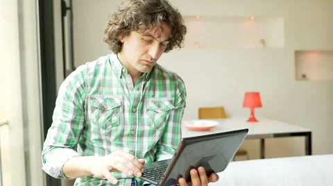 Absorbed man typing something on laptop, steadycam shot Stock-Footage 62975226