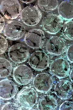 Absract background of shiny plastic and bubbles dreating bright sci-fi styl.. Stock Photos