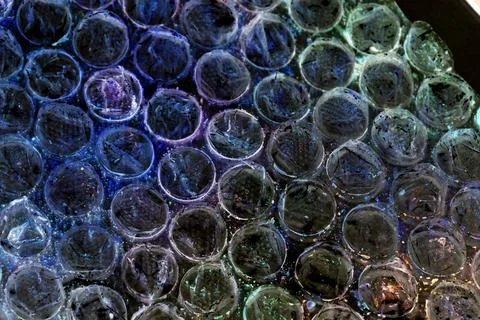 Absract background of shiny plastic and bubbles dreating bright sci-fi styl.. Stock Photos