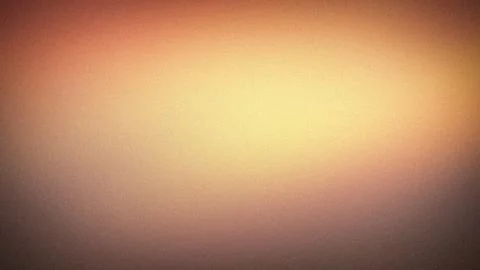 Abstract 4K background with grainy texture and warm blurred gradient in gol.. Stock Photos