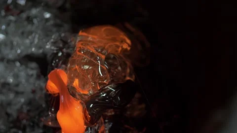 Abstract 4K background of melted glass glowing in hot red and orange. Stock Footage 144061753