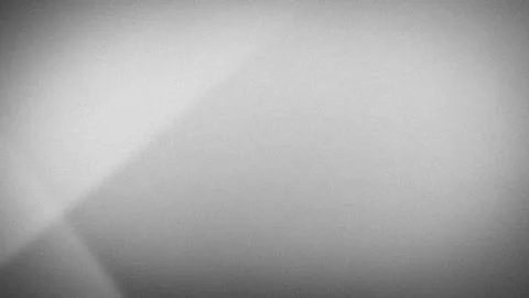 Abstract 4K grainy gradient background with bright white, grey and black sm.. Stock Photos