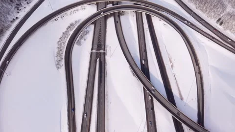 Abstract aerial highway interchange pattern in winter landscape Stock Footage 328963144