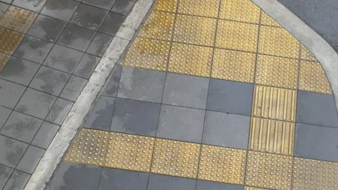 Abstract Aerial Pattern of Orange Tactile Paving Arrow Design Stock Footage 344919722